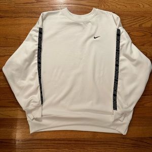 Large Women’s Nike Sweatshirt. White w/black Nike steps on sleeves. Never worn.